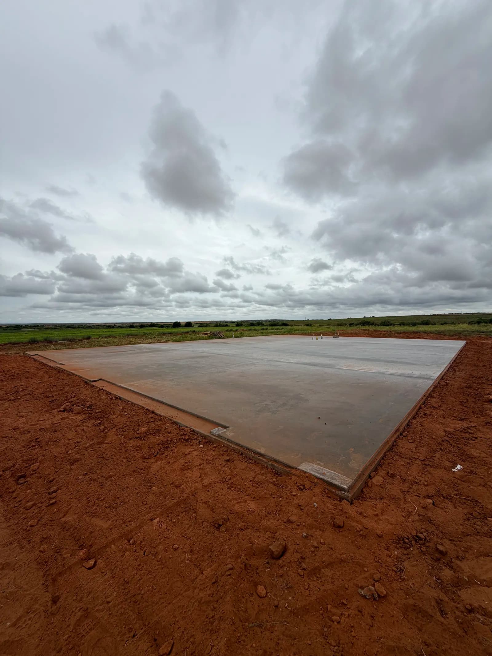 Paducah 50' x 70' Metal Building Foundation — freshly finished slab surface in Paducah, TX