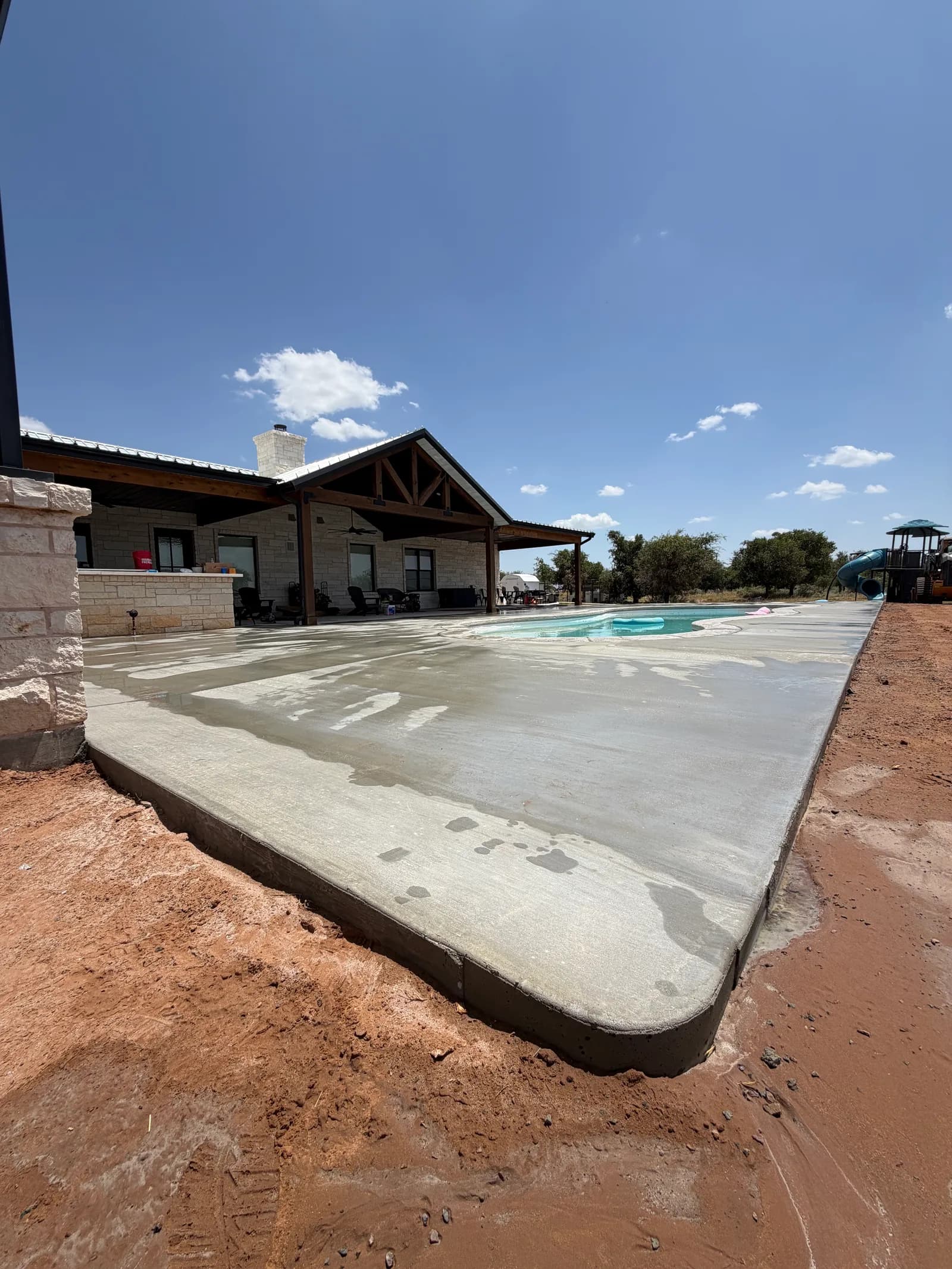 El Dorado Concrete Pool Deck — aerial view of the completed wraparound deck in El Dorado, OK
